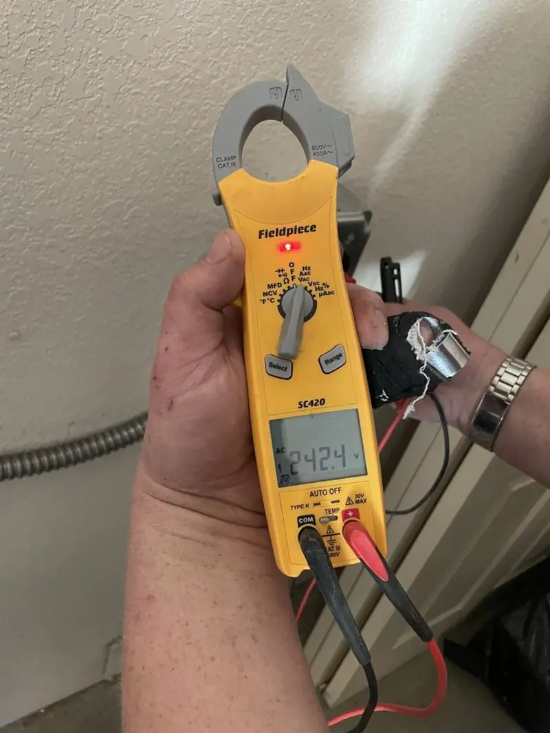 Voltage testing with clamp meter during Generator Installation in Omaha